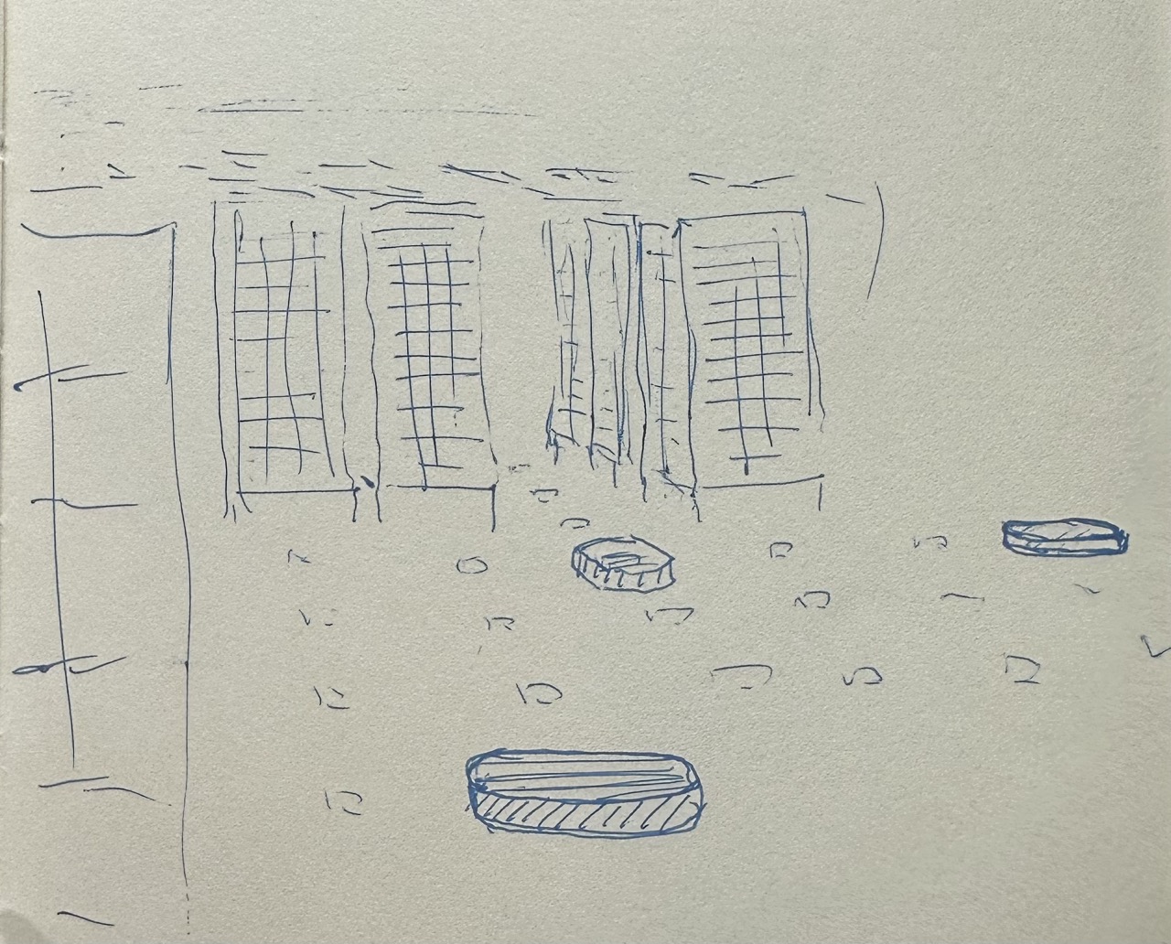 Hand-drawn doodle of Kiva robots moving inventory pods through a QR-coded grid