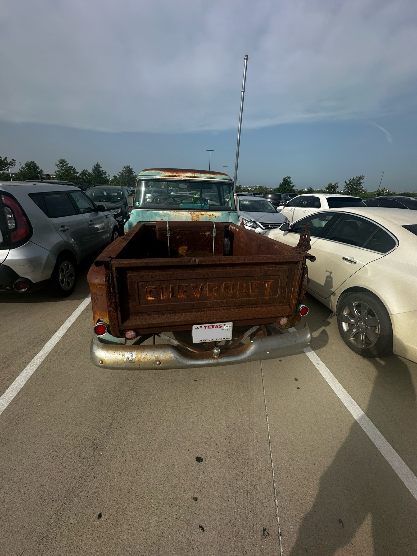 A vintage truck parked in the Amazon employee lot