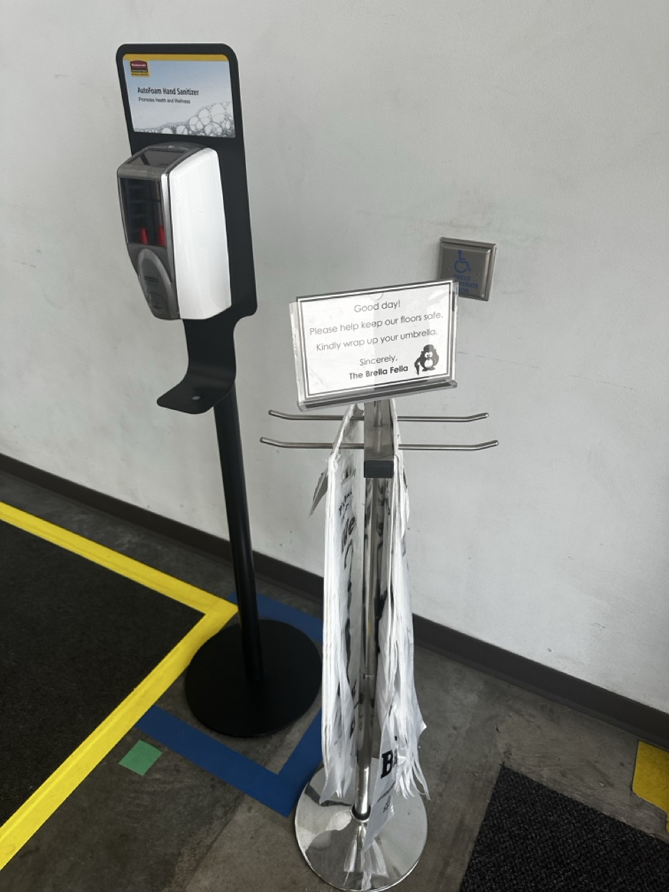 Overhead safety signage about wet floors