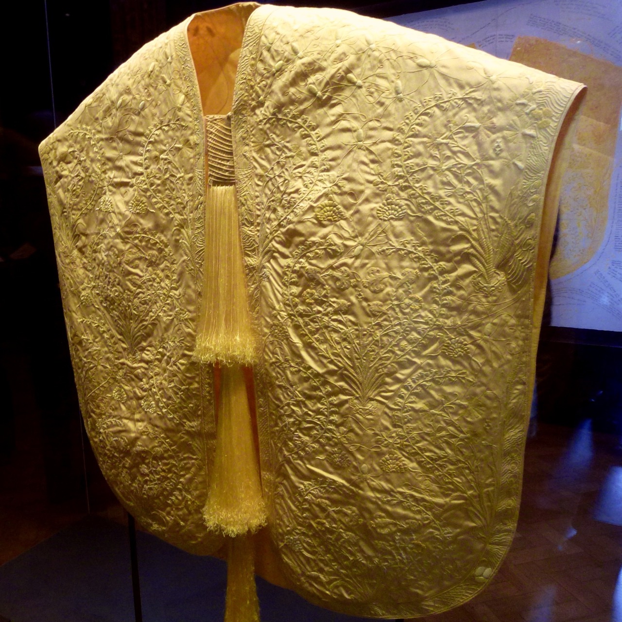 A golden orb weaver silk cape displayed at the V&A